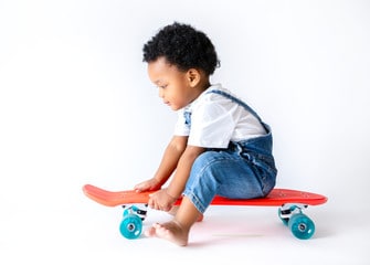 Toddler boy on a skateboard