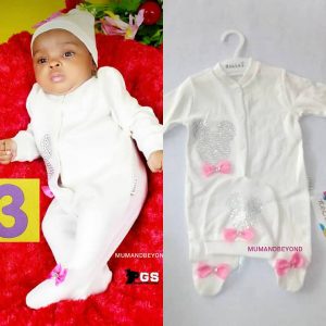 Pic of baby in white 2 piece outfit