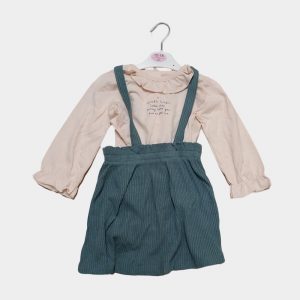 Girl's green pinafore and cream top